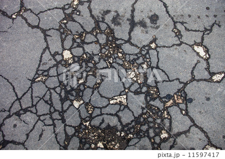 Cracked asphalt surface Cracked asphalt surface 11597417