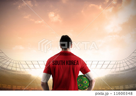Composite image of south korea football player holding ball 11600348