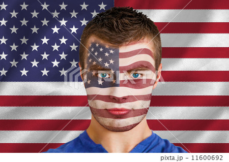 Composite image of serious young usa fan with facepaint 11600692
