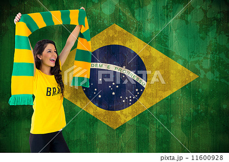 Composite image of excited football fan in brasil tshirt Composite image of excited football fan in brasil tshirt 11600928