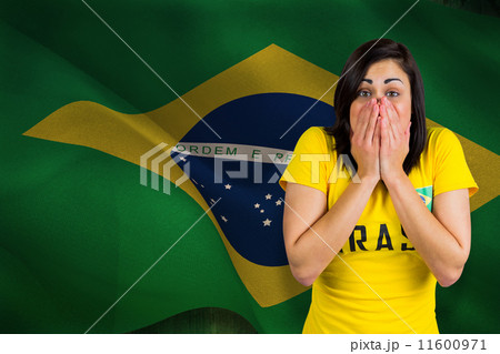 Composite image of nervous football fan in brasil tshirt 11600971