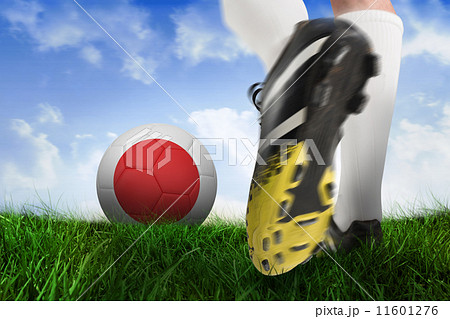 Composite image of football boot kicking japan ball 11601276