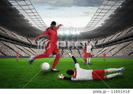 Football player in red kicking 11601418