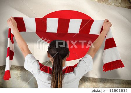 Composite image of football fan waving red and white scarf Composite image of football fan waving red and white scarf 11601655