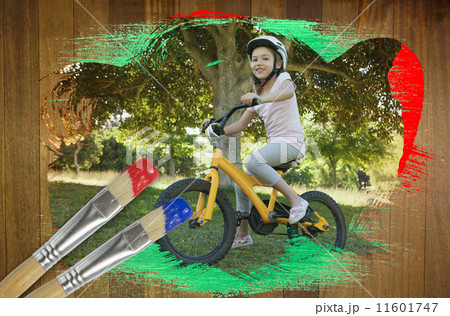 Composite image of little girl on a bike 11601747