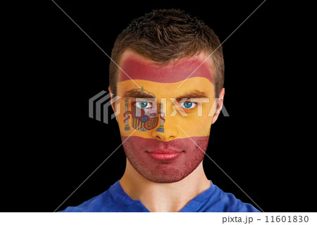Composite image of serious young spain fan with facepaint Composite image of serious young spain fan with facepaint 11601830