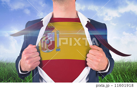 Composite image of businessman opening shirt to reveal spain fla Composite image of businessman opening shirt to reveal spain fla 11601918