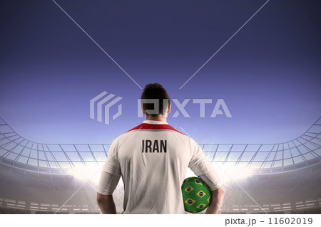 Composite image of iran football player holding ball 11602019