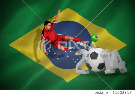 Composite image of fit football player jumping and kicking Composite image of fit football player jumping and kicking 11602317