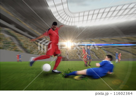 Football player in red kicking 11602364
