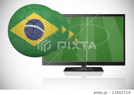 Composite image of football in brasil colours flying out of tv 11602516