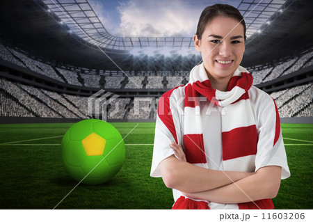 Composite image of football fan in white wearing scarf 11603206