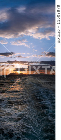 Panoramic sunset over boat motor ripples on the water 11603979