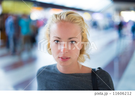 Young woman on platform of railway station. 11606212