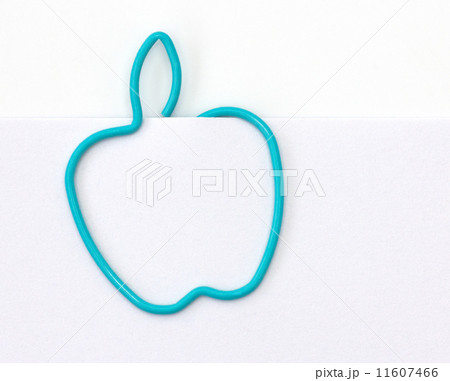 Paper clip in the form of apple on a sheet of paper Paper clip in the form of apple on a sheet of paper 11607466