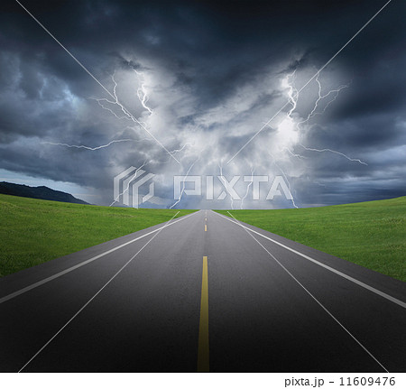 rainstorm clouds and lightning with asphalt road and grass 11609476