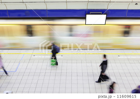 people walking on platform at metro station 11609615