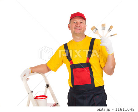 Worker shows painting brushes. Worker shows painting brushes. 11611648