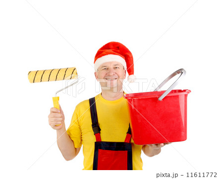 Worker in santa's hat with bucket. Worker in santa's hat with bucket. 11611772