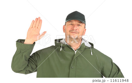 Man in coat shows hand. 11611948