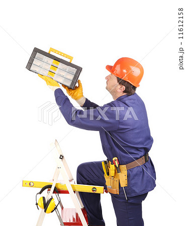 Worker in protective helmet on ladder with toolbox. Worker in protective helmet on ladder with toolbox. 11612158