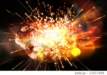 Composite image of fit football player jumping and kicking 11617896