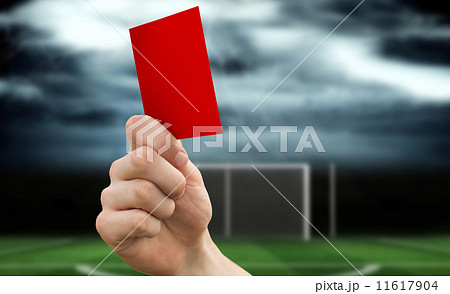 Composite image of hand holding up red card 11617904