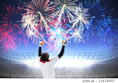 Composite image of excited goalkeeper in white cheering Composite image of excited goalkeeper in white cheering 11618007