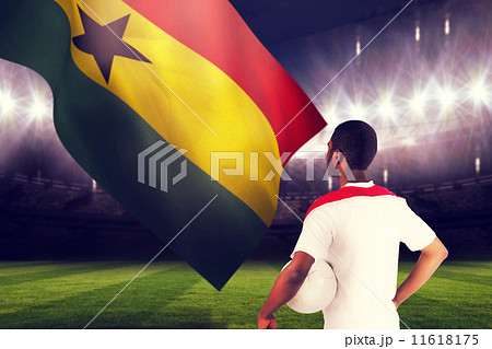 Composite image of football fan in white holding ball Composite image of football fan in white holding ball 11618175