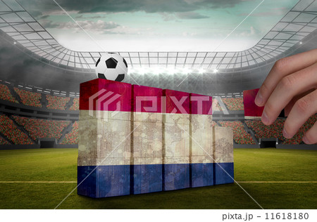Composite image of hand building wall Composite image of hand building wall 11618180