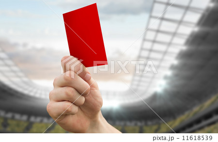Composite image of hand holding up red card Composite image of hand holding up red card 11618539