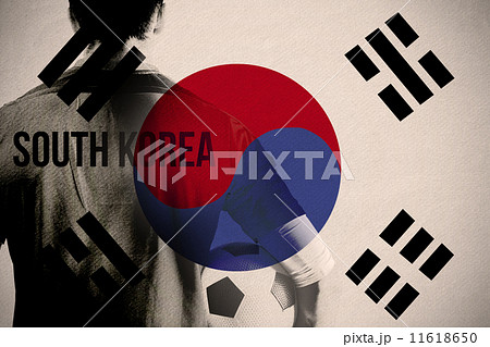 Composite image of south korea football player holding ball 11618650