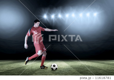 Composite image of football player in red kicking Composite image of football player in red kicking 11618781