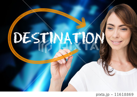 Businesswoman writing the word destination 11618869