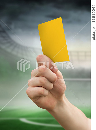 Composite image of hand holding up yellow card 11619044