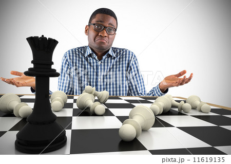 Composite image of young businessman shrugging shoulders 11619135