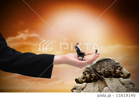 Composite image of businesswoman sitting on swivel chair with fe 11619140