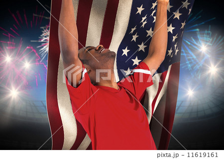 Composite image of excited handsome football fan cheering Composite image of excited handsome football fan cheering 11619161