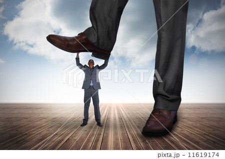 Composite image of businessman stepping on tiny businessman Composite image of businessman stepping on tiny businessman 11619174