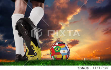 Composite image of football boot kicking flag ball 11619250