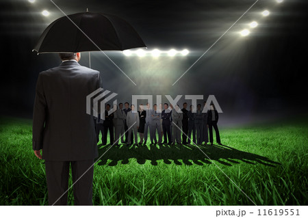 Composite image of mature businessman holding an umbrella Composite image of mature businessman holding an umbrella 11619551