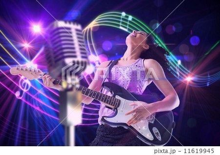 Composite image of pretty girl playing guitar 11619945