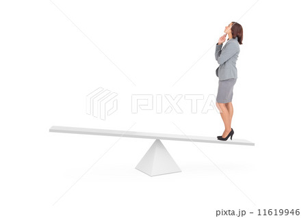Composite image of focused businesswoman on scales 11619946