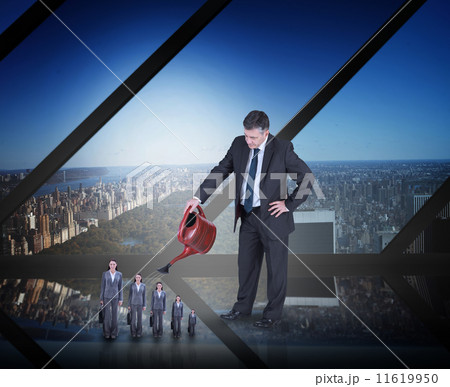 Composite image of mature businessman watering tiny businesswoma 11619950