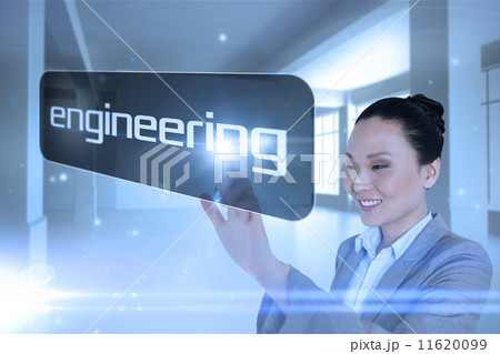 Businesswoman pointing to word engineering 11620099