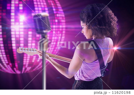 Composite image of pretty girl playing guitar Composite image of pretty girl playing guitar 11620198