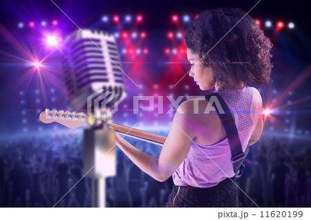 Composite image of pretty girl playing guitar Composite image of pretty girl playing guitar 11620199