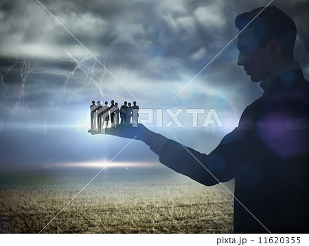 Composite image of businessman holding business team Composite image of businessman holding business team 11620355