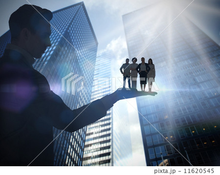 Composite image of businessman holding business team Composite image of businessman holding business team 11620545