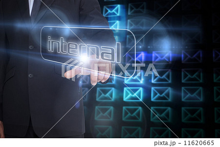 Businessman pointing to word internal Businessman pointing to word internal 11620665